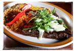 MEXICAN SPECIALTIES Skirt Steak Tampiquena 10 oz Certified Angus Beef skirt steak covered with sauted onions, poblano peppers, melted Monterrey Jack cheese and served with one cheese enchilada,