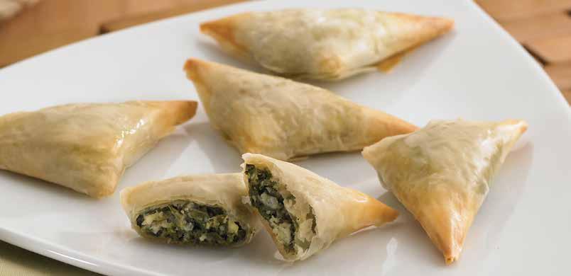 Phyllo Spanakopita (Grecian Triangles) Light as air phyllo dough triangles filled with spinach, feta cheese and Mediterranean
