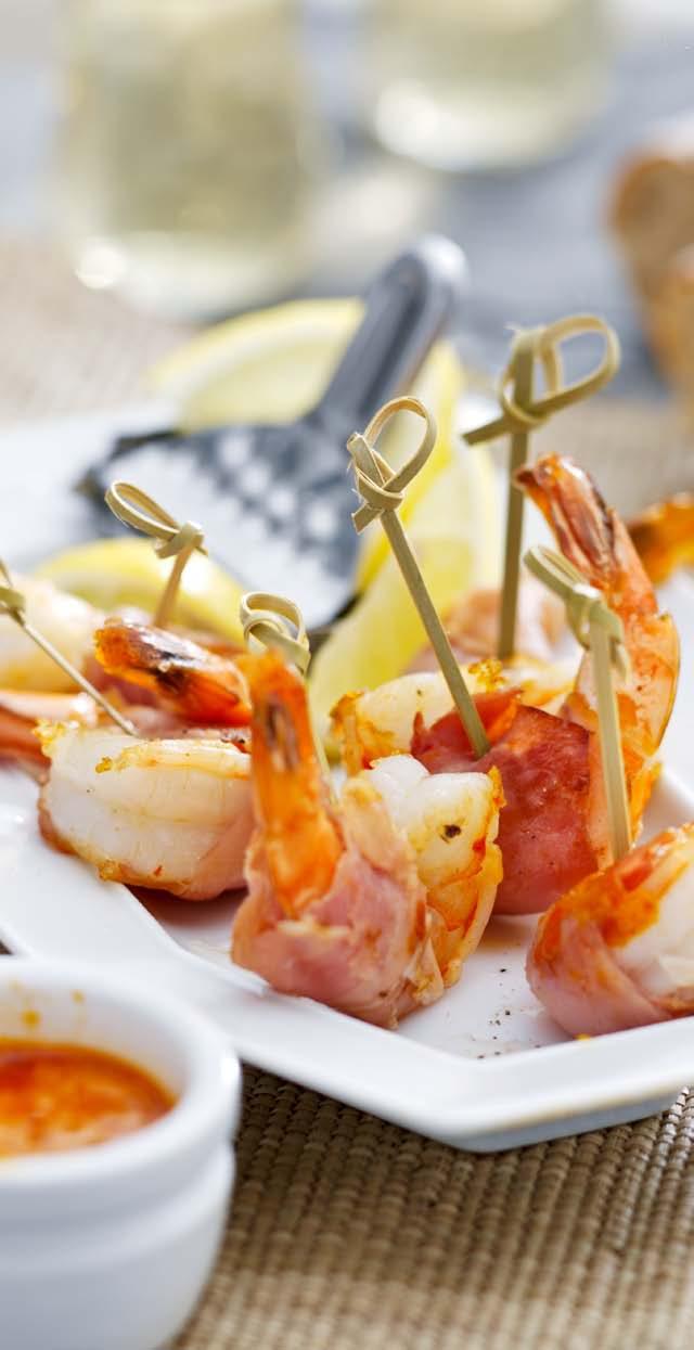King Prawns in Ham with Red Pepper Dip Appetizer 10 por tions 15 minutes + 13 minutes airfr yer 1 large red bell pepper, halved 10 (frozen) king prawns, defrosted 5 slices of raw ham 1 tablespoon