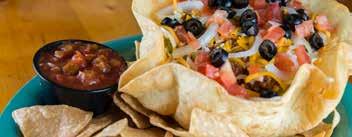 99 House-made tortilla chips topped with refried beans, cheese, lettuce, tomatoes, onions, green peppers, and black olives. Served with salsa and your choice of chicken, beef, or pork.