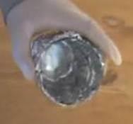 around base of water bottle, then rolling down top edge for strength.