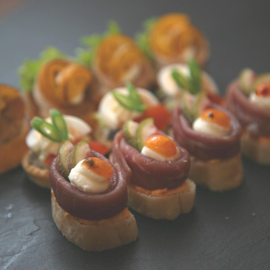 Canapés., Delicate piece of pastry, toast, vegetable, etc.