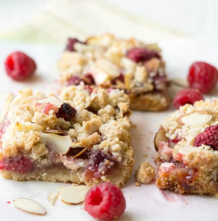 Gluten Free Raspberry Cream Cheese Bars 3 ½ cup butter, melted ¾ cup raw sugar 1 cup gluten free flour blend ¾ cup almond flour 1 cup raspberries 3 tablespoons raw sugar ¾ cup raspberry jam 1 cup