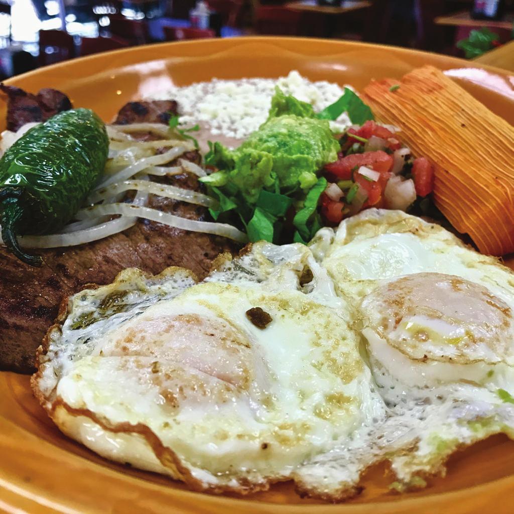 45 A flour tortilla filled with scrambled eggs, hash browns, and your choice of meat (optional), topped with cheese and smothered in our pork or vegetarian green chile with sour cream