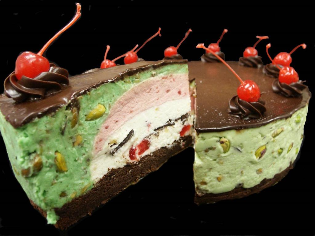 First green pistachio mousse (laden with pistachio nuts) followed by a layer of fresh strawberry mousse, then the