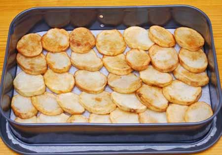 21 12 Arrange a layer of potatoes in the bottom of a rectangular baking dish