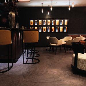 Accessed through a secret wall, featuring personalised bottle lockers for members, a private bar, fireplace and a private six