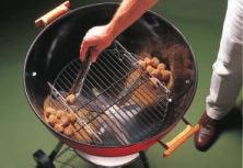 Once it is burning, replace barbecue lid, and it will begin smoking quite intensely. It is important use chunks smoking wood rar than chips or sawdust.