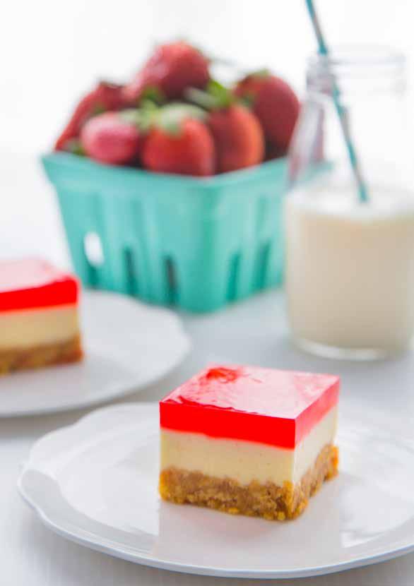 CheesecakeJelly Slice SERVES: 24 PREP: 45 MIN + CHILLING DIFFICULTY: MEDIUM This classic Australian triple layer slice has a firm biscuit base, luscious creamy cheesecake middle and wobbly jelly to