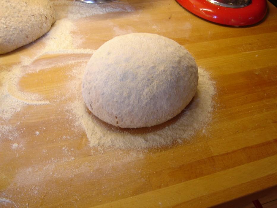 It helps to let the dough rest for 5-10 minutes after the first few minutes of kneading to give the flour time to absorb the water. It should then be much less sticky.