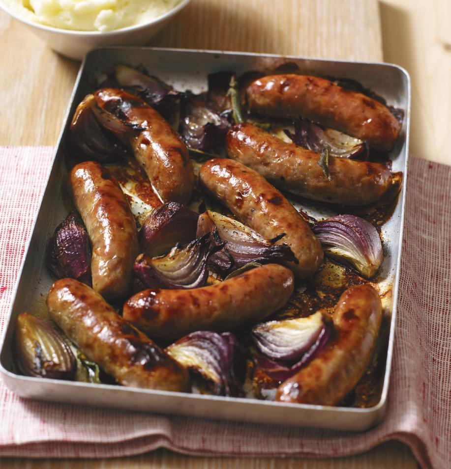 SAUSAGES with red onions SERVES: 3-4 PREP: 5 mins COOK: 30-40 mins 8 nice meaty sausages 2 or 3 small red onions, peeled and quartered 2 tsp olive oil plus extra to oil the cooking dish 8 sage leaves