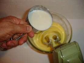 Step 5 - Slowly add 1 cup of the hot milk mixture to the egg yolks While constantly whisking, slowly add 1 cup of the hot milk mixture and whisk until it is blended (a few seconds).