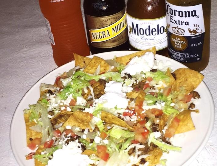 TOSTADAS $2.75 NACHO SUPREME A deep fried corn tortilla, topped with beans and your choice of steak, pork, chicken or seasoned ground beef.