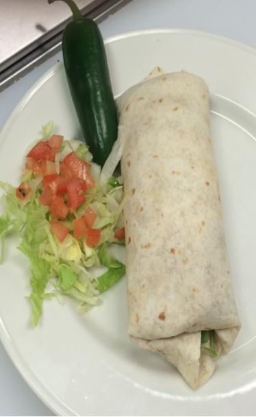 50 A homemade corn tortilla, opened & stuffed with your choice of steak, pork, chicken or seasoned ground beef. Topped with lettuce, tomatoes, cheese & sour cream.