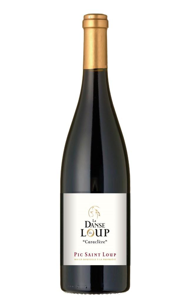 LA DANSE DU LOUP - Cuvée «CARACTERE» AOP Pic Saint Loup Grape Varieties : 80% Syrah - 20% Grenache. Red wine. Terroir : Rolled pebbles and sandy clays. of the grapes.