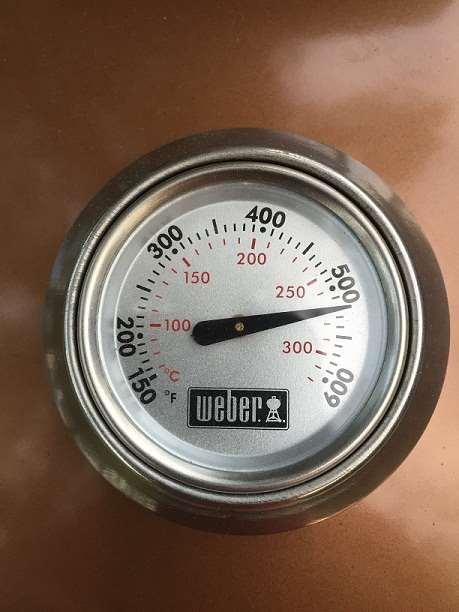 You will notice that the thermometer on the lid is DIRECTLY over the fire. The thermometer is going to tell you that the grill is REALLY hot.