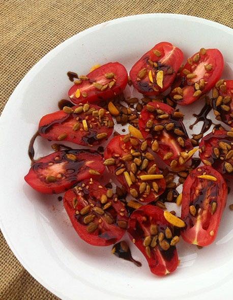 VINE-RIPENED TOMATOES WITH SPICED SEEDS & BALSAMIC Serves 2 8-12 vine-ripened cherry or Roma tomatoes, halved 2-3 tablespoons balsamic vinegar reduction Place the tomato halves on a serving plate