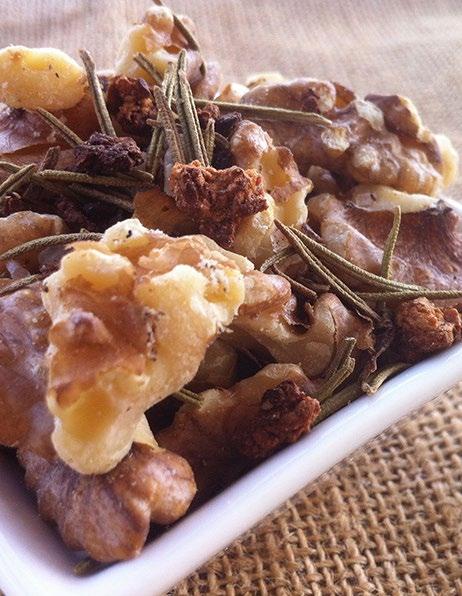 GARLIC & ROSEMARY SALTED WALNUTS Makes 1 Cup 1 cup roughly chopped walnuts 2 teaspoons smoked garlic pieces 1 teaspoon dried rosemary leaves ½ teaspoon sea salt Place a frying pan on low heat and add