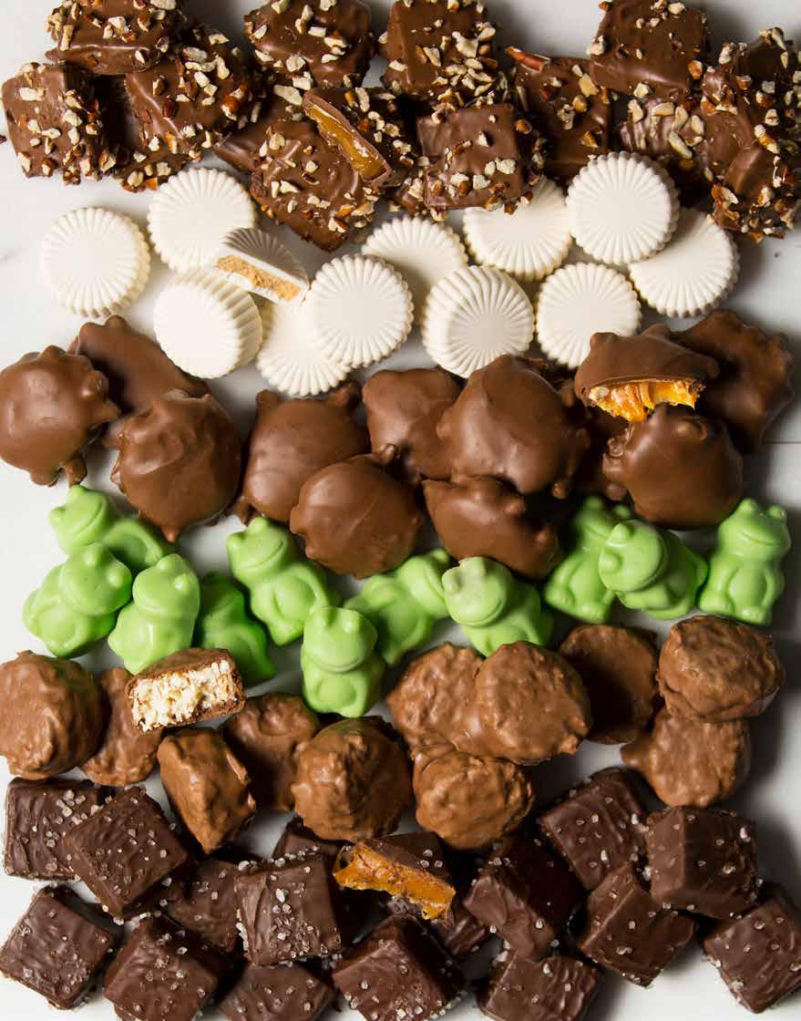 ENGLISH BUTTER TOFFEE WHITE CHOCOLATE PEANUT BUTTER CUPS CHOCOLATE CONFECTION PECANBACKS CARAMEL CLUSTERS BEST-SELLING CHOCOLATES FOR YEAR-ROUND INDULGENCE FROG FUDGIES COCONUT ALMOND TREASURES DARK