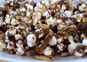 S mores Popcorn 1-1/2 bags Microwaveable Popcorn 1/2 box Golden Graham cereal 1/2 bag miniature marshmallows 1 12 ounce bag of chocolate chips Pop the popcorn as directed on bag.