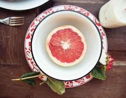 cereal bowl and a juicy grapefruit.