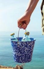 D F E SWEET ON THE BEACH Enamelware provides a refreshingly sweet and crisp finish to any al fresco dining setting.
