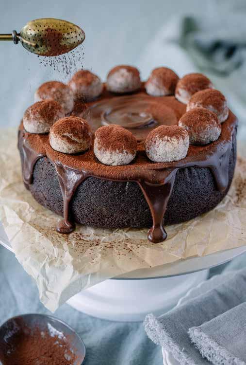 Chocolate Simnel Cake TRADITIONALLY SERVED AS A FRUIT CAKE AND TOPPED WITH MARZIPAN BALLS, WE VE GIVEN THIS CLASSIC EASTER CAKE AN UPDATE WITH RICH CHOCOLATE GANACHE AND SOUR CHERRIES FOR A