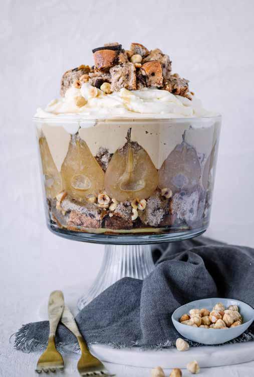 Chocolate Hot Cross Bun Easter Trifle THIS INDULGENT DESSERT WITH BOOZY BUTTERSCOTCH CUSTARD AND CARAMELISED PEARS IS THE PERFECT WAY TO USE UP ANY LEFT OVER HOT CROSS BUNS.