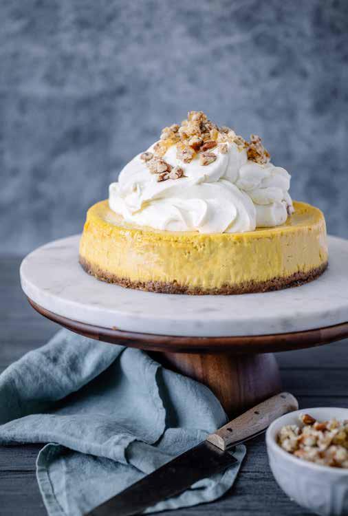 Carrot Cake Cheesecake PILED HIGH WITH WHIPPED VANILLA CREAM AND A SPRINKLE OF CRUNCHY PECAN PRALINE, THIS CHEESECAKE IS A TRULY DECADENT REINTERPRETATION OF CLASSIC FLAVOURS!