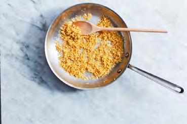Heat 2 tablespoons oil in a large skillet over medium. Add panko and cook, stirring occasionally, until golden brown, 5 6 minutes. Stir in garlic and continue to cook until fragrant, about 1 minute.