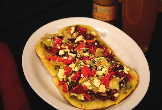 A p etizers Mediterranean Flat Bread Topped with pesto, sundried tomatoes, artichoke hearts, roasted red peppers, kalamata olives, feta cheese. 10.