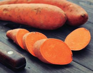 Then season both halves with salt and pepper. Peel the sweet potatoes and chop them into fairly large chunks.