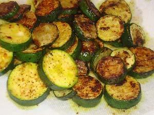 Fried Zucchini, Bangla Style 4 or 5 small zucchini 2 tablespoons mustard oil 2 tablespoons vegetable oil (OR 4 tablespoons vegetable oil with ¼ teaspoon dry mustard added) ¼ teaspoon turmeric ¼
