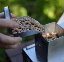 Once your starter pellets are fully alight, add small amounts of pellets gradually.