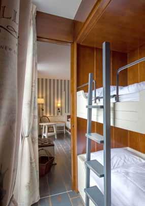 The two en-suite bedrooms with double beds and the living room with a bunk bed can