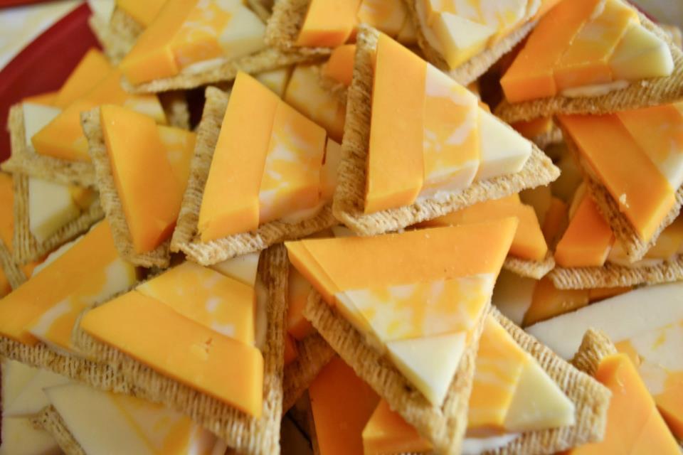 Candy Corn Cheese and Crackers Arrange cheese on