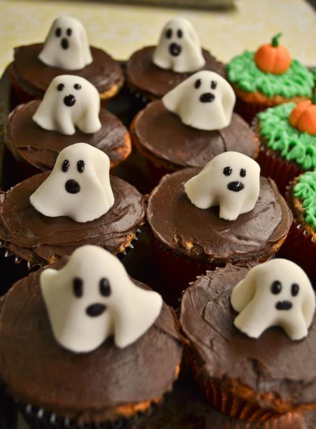Ghost Cupcakes Cut a small round piece of fondant.