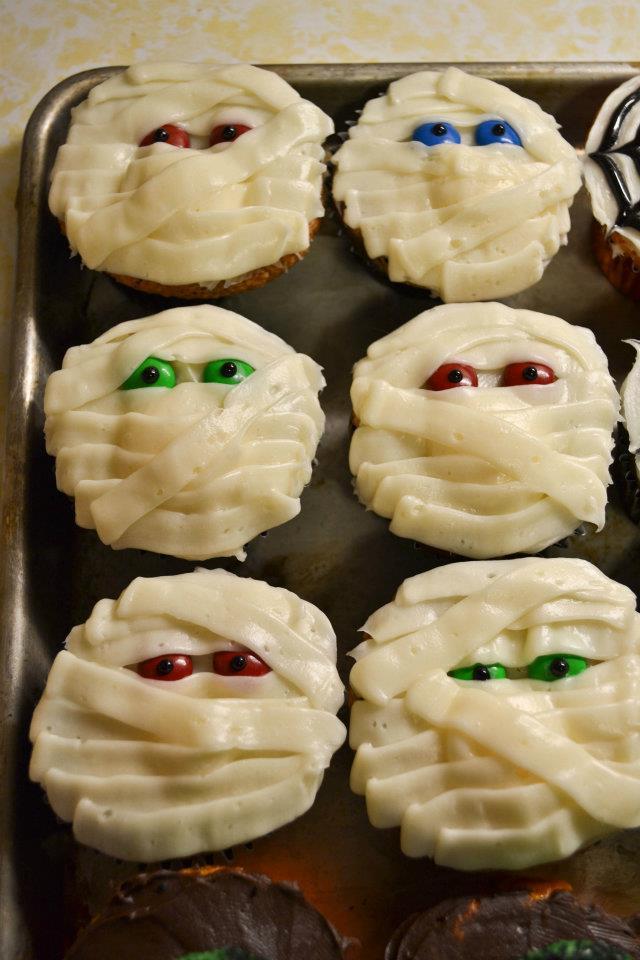 Mummy Cupcakes Frost cupcakes with a thin layer of white icing. Place 2 M&Ms for eyes.