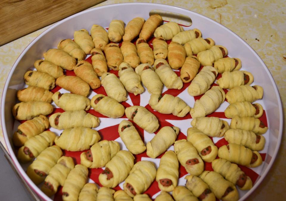 Mummy Pigs in a Blanket Instead of wrapping the mini hot dogs with crescent dough