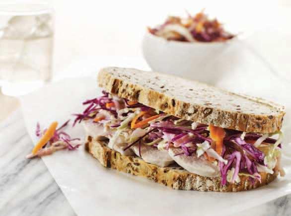 and coleslaw dressing. Arrange shredded chicken on two slices of bread and add the coleslaw salad. Top with remaining bread and serve immediately. Substitute apple with pineapple chunks.