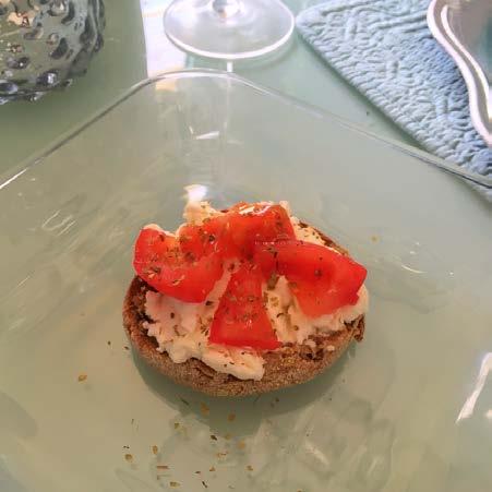 3 ounces of park skim ricotta cheese Toast English muffin. Spread on cheese. Top with tomato, oregano and garlic.