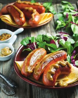 Outback Snags 1 packet of beef sausages 1 tablespoon of olive oil 1 chopped onion 1 cup of diced tomatoes cracked pepper (for seasoning) mild english mustard wholegrain mustard 1.