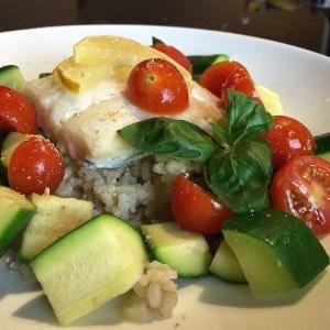 Baked Fish with Fresh Herb and Vegetable Medley Yield: 2 servings You will need: baking sheet, parchment paper, knife, cutting board, cooking oil spray 2 4-6 oz servings of fish (halibut, sole, red
