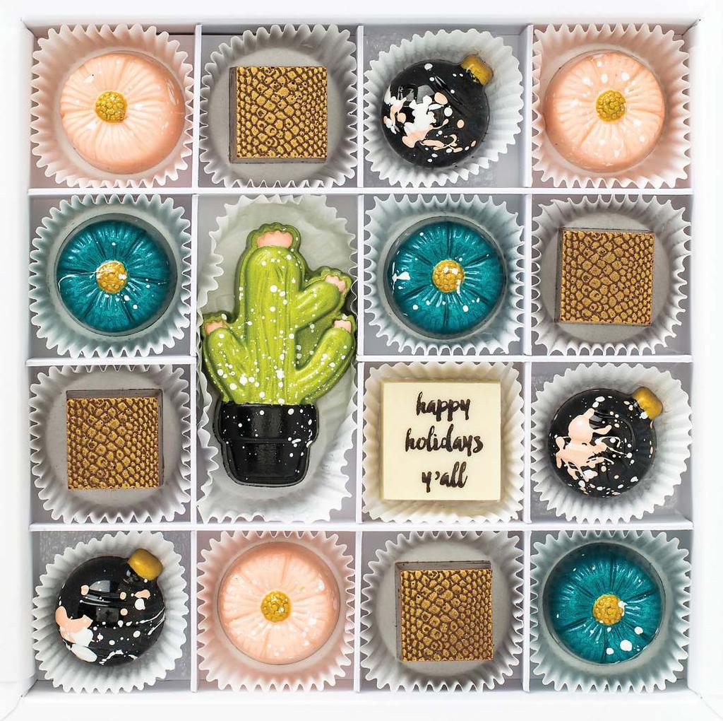 happy holidays y all (4) dark chocolate snakeskin squares illed with vanilla marshmallow + spiced graham cracker (3) white chocolate cactus lowers illed with vanilla bean ganache (3) dark chocolate
