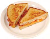 Classic American Sandwiches Cheese Meat GRILLED CHEESE... 4.95 BACON, LETTUCE & TOMATO... 5.25 American, Muenster, cheddar, Swiss, mozzarella with Tomato... 5.45 BOILED HAM... 4.95 with Bacon or Ham.