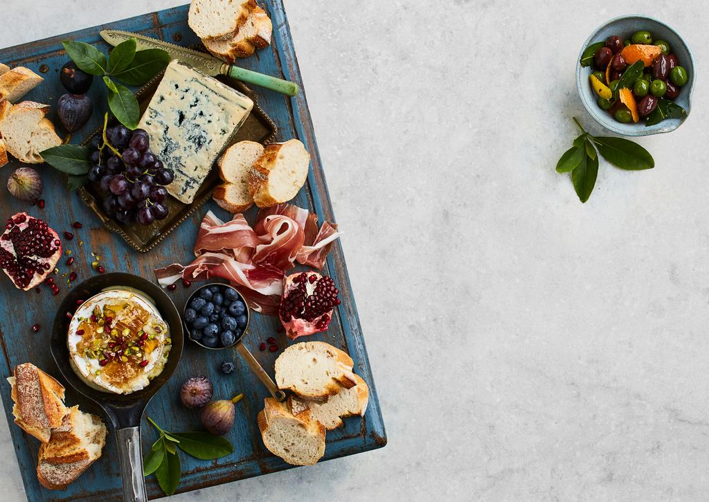 Cheese Platter Serves 8-10 2 BAKERS DELIGHT AUTHENTIC SOURDOUGH BAGUETTES 1 SMALL WHEEL OF CAMEMBERT FRESH HONEYCOMB PISTACHIO NUTS WEDGE OF BLUE CHEESE 100g PROSCIUTTO FIGS, GRAPES, BERRIES,