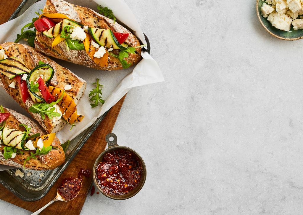 Grilled Vegetable Baguette with Fetta and Chilli Jam Serves 4 2 BAKERS DELIGHT AUTHENTIC MIXED SEED SOURDOUGH BAGUETTES 3 SMALL ZUCCHINIS SLICED IN THICK RIBBONS 2 SMALL YELLOW CAPSICUMS, SEEDED AND