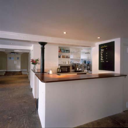 The Lower Space The Lower space has white walls, an original Yorkstone floor, cast iron pillars and large,