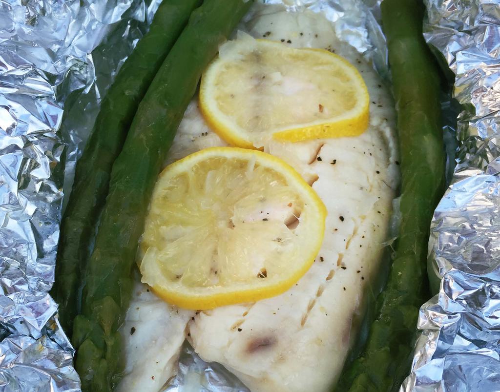 RECIPE 2 GRILLED TILAPIA WITH LEMON (SINGLE RECIPE, DO THIS TWICE) 4-5 tilapia filets (about half a bag of Aldi Sea Queen Tilapia, frozen), thawed 1/2 package of asparagus 1 lemon, thinly sliced 1/4