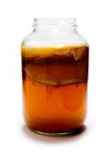 The scoby bacteria and yeast eat most of the sugar in the tea, transforming the tea into a refreshingly fizzy, slightly sour fermented (but mostly non-alcoholic) beverage that is relatively low in